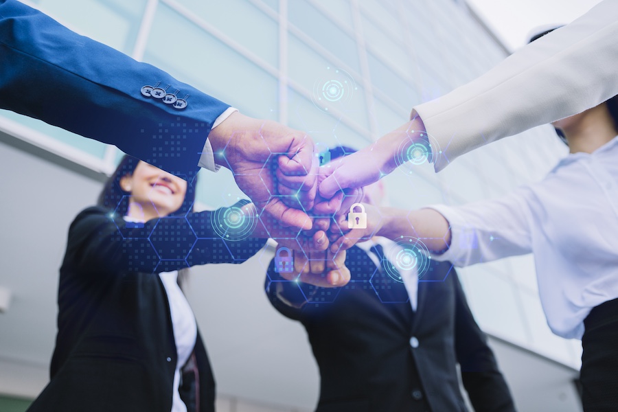young-business-people-putting-their-hands-together